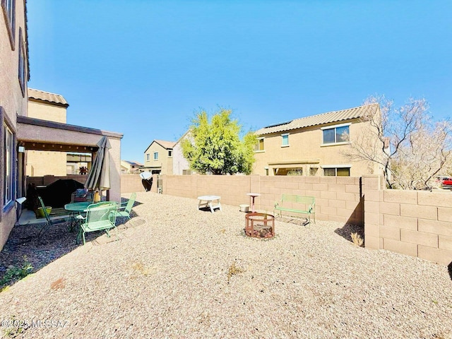 view of yard featuring a patio area and a fenced backyard
