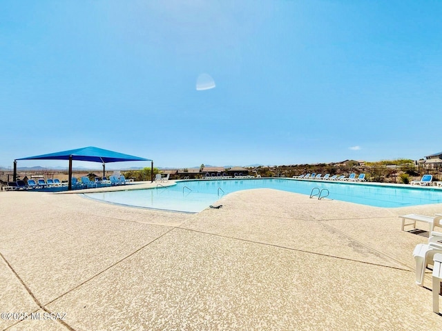 pool with a patio area