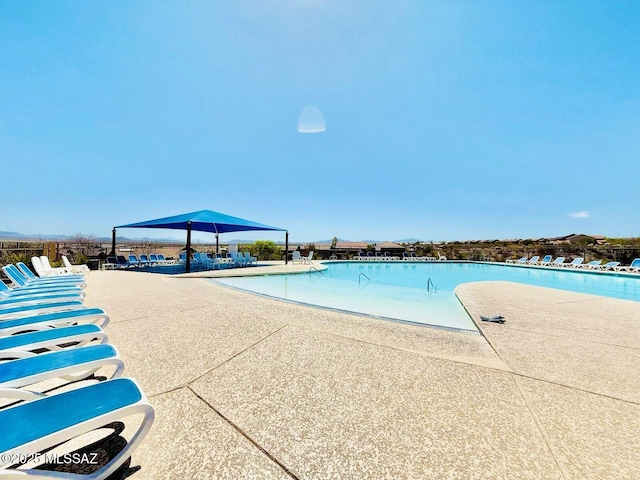 pool with a patio area