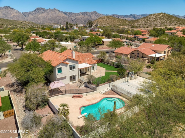 aerial view with a mountain view and a residential view