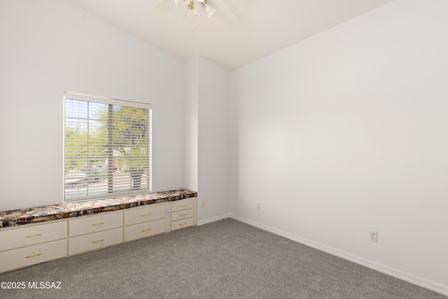 unfurnished room with light colored carpet, baseboards, ceiling fan, and lofted ceiling