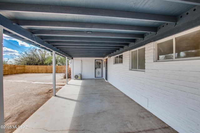 view of patio / terrace featuring fence