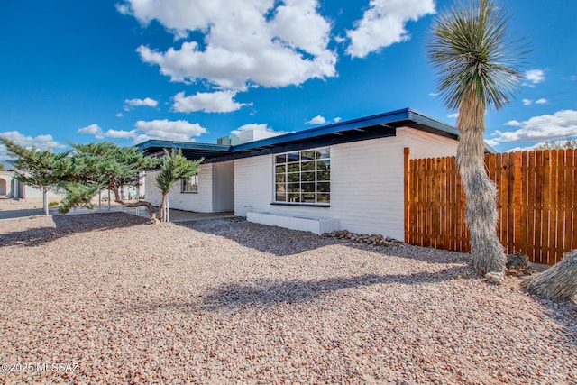 view of front of house with fence
