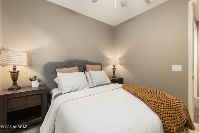 bedroom with visible vents, a ceiling fan, lofted ceiling, and carpet