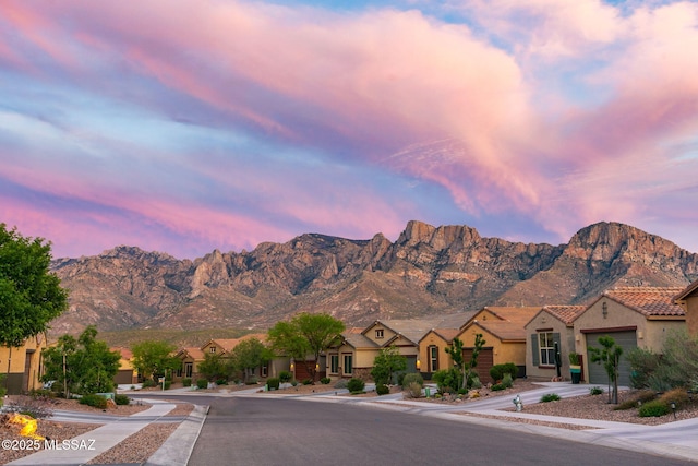 property view of mountains featuring a residential view