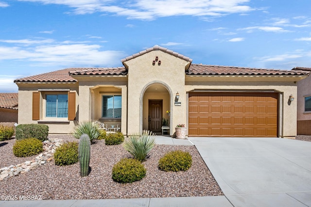 14077 N Bright Angel Trl, Marana, AZ 85658 - mediterranean / spanish home with stucco siding, concrete driveway, an attached garage, and a tiled roof