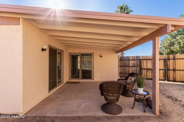 view of patio featuring fence