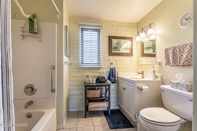full bathroom with tile patterned floors, toilet, shower / bath combination, baseboards, and vanity