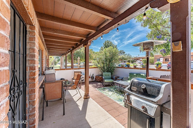 view of patio featuring a grill