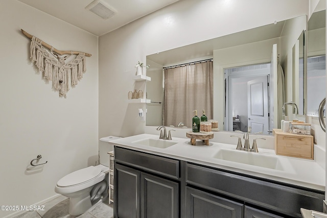 full bath with double vanity, toilet, visible vents, and a sink