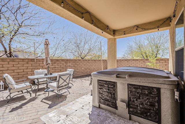 view of patio / terrace with outdoor dining space and a fenced backyard