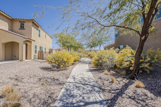 view of home's community with fence