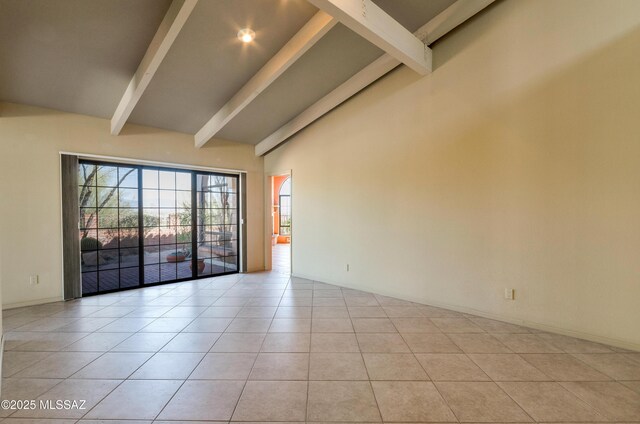 5460 N Paseo Pescado, Tucson, AZ 85718 - empty room featuring beamed ceiling, light tile patterned flooring, and high vaulted ceiling