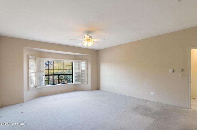 5460 N Paseo Pescado, Tucson, AZ 85718 - spare room featuring light carpet and ceiling fan