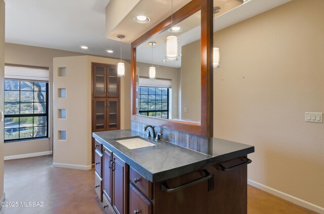 5460 N Paseo Pescado, Tucson, AZ 85718 - bar area featuring healthy amount of natural light, hanging light fixtures, and recessed lighting