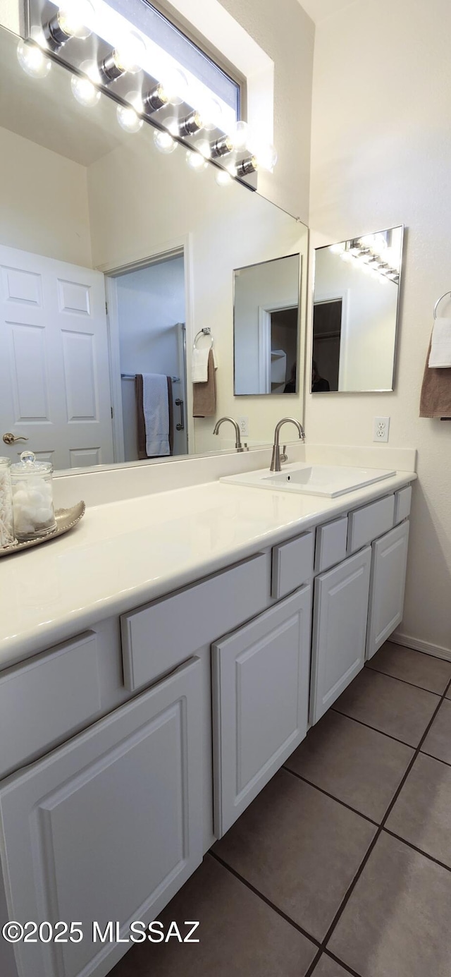 bathroom with vanity and tile patterned floors