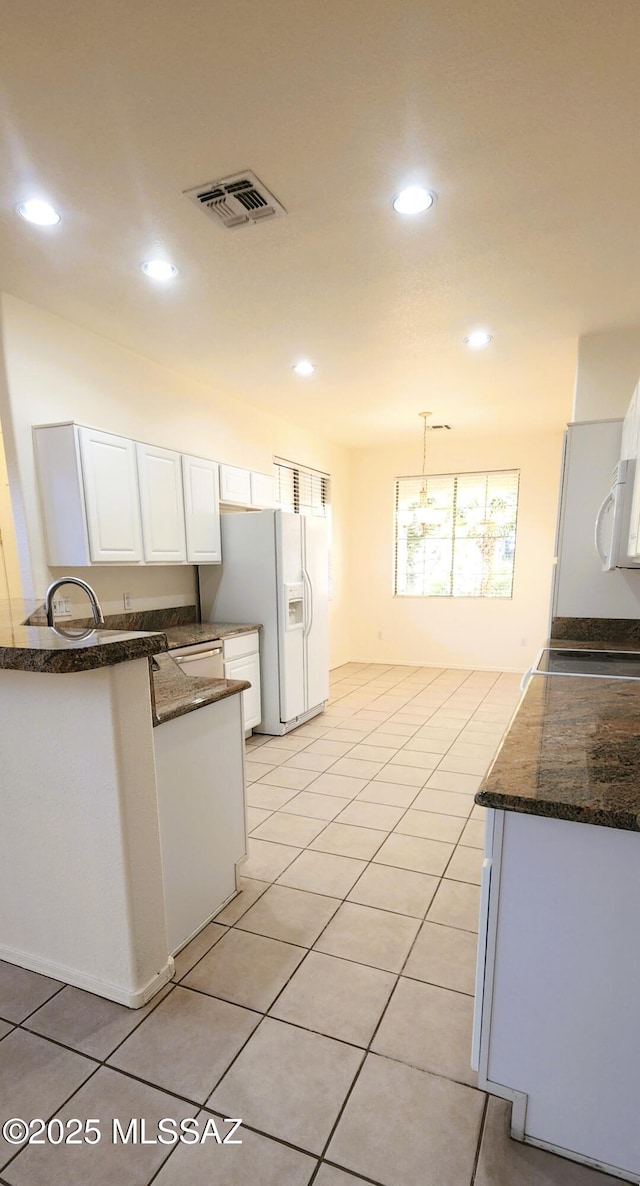 kitchen featuring white cabinets, visible vents, recessed lighting, and white appliances