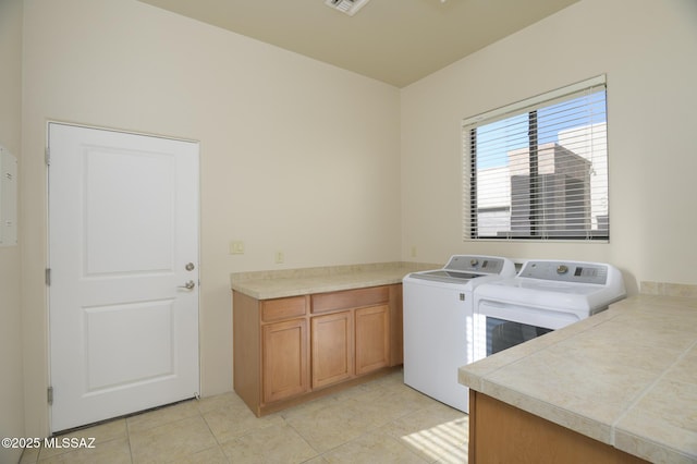 11626 N Moon Ranch Pl, Marana, AZ 85658 - laundry room with light tile patterned floors, cabinet space, and washing machine and clothes dryer