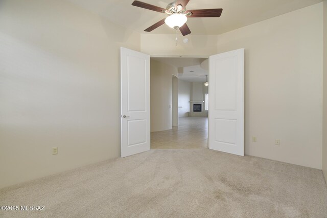 11626 N Moon Ranch Pl, Marana, AZ 85658 - spare room with light carpet and ceiling fan