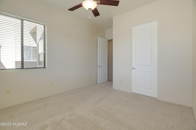 11626 N Moon Ranch Pl, Marana, AZ 85658 - unfurnished bedroom featuring a ceiling fan and carpet floors