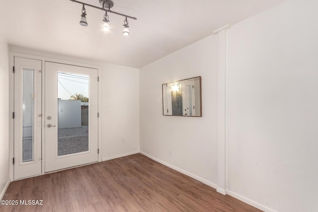 7267 E Eastview Dr, Tucson, AZ 85710 - unfurnished room featuring wood finished floors and baseboards