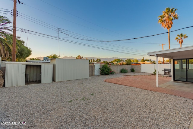 7267 E Eastview Dr, Tucson, AZ 85710 - view of yard with a patio area and a storage unit