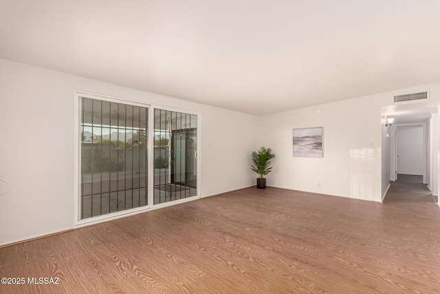 7267 E Eastview Dr, Tucson, AZ 85710 - empty room featuring wood finished floors
