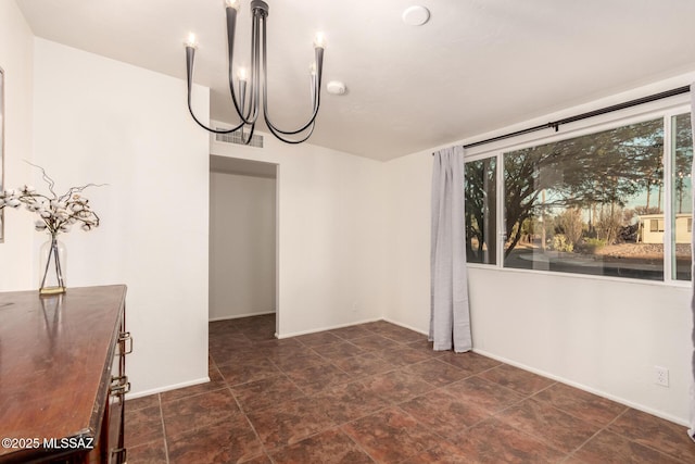 7267 E Eastview Dr, Tucson, AZ 85710 - empty room featuring a chandelier, baseboards, and a smoke detector