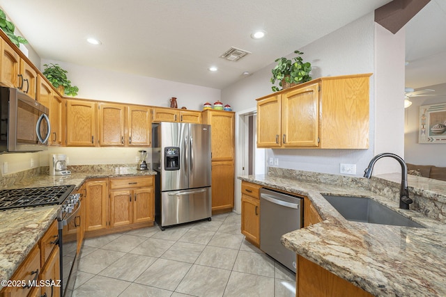 1117 E Regent Dr, Oro Valley, AZ 85755 - kitchen featuring light stone counters, recessed lighting, appliances with stainless steel finishes, and a sink