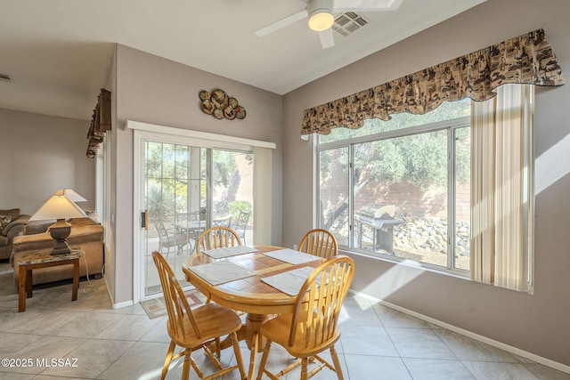 1117 E Regent Dr, Oro Valley, AZ 85755 - dining area with light tile patterned floors, a ceiling fan, visible vents, baseboards, and vaulted ceiling