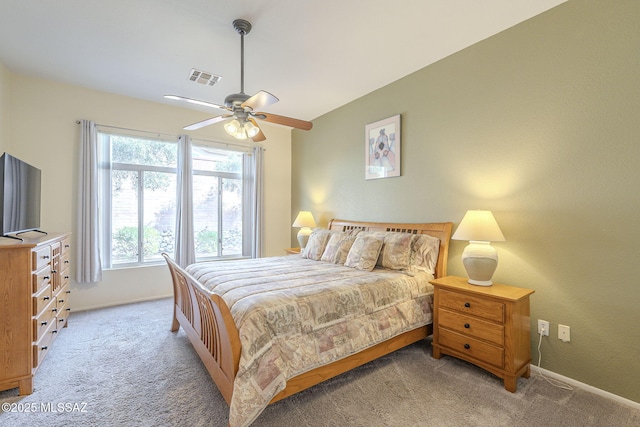 1117 E Regent Dr, Oro Valley, AZ 85755 - bedroom with light carpet, visible vents, ceiling fan, and baseboards