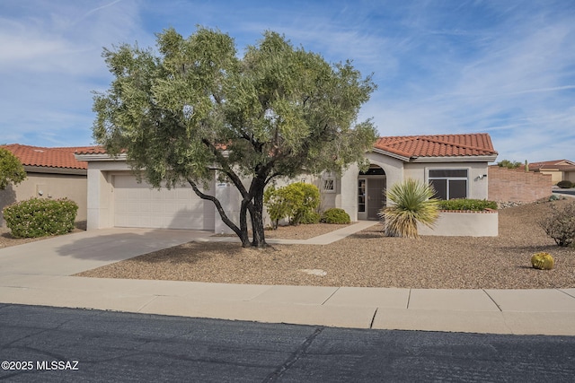 1117 E Regent Dr, Oro Valley, AZ 85755 - mediterranean / spanish-style house featuring stucco siding, concrete driveway, an attached garage, and a tile roof