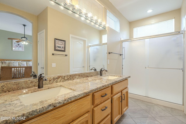 1117 E Regent Dr, Oro Valley, AZ 85755 - full bath with a sink, double vanity, a shower stall, and tile patterned floors