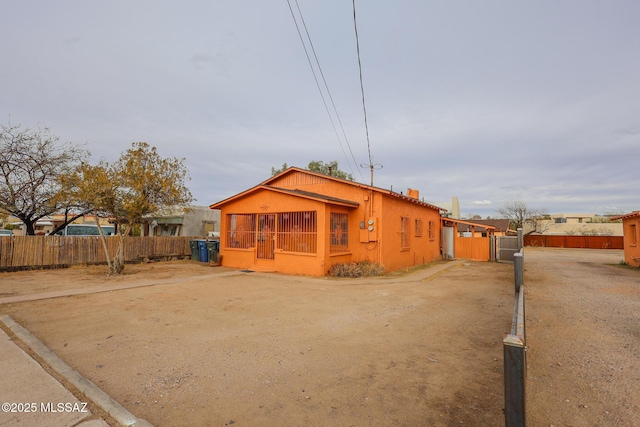view of front of house with fence