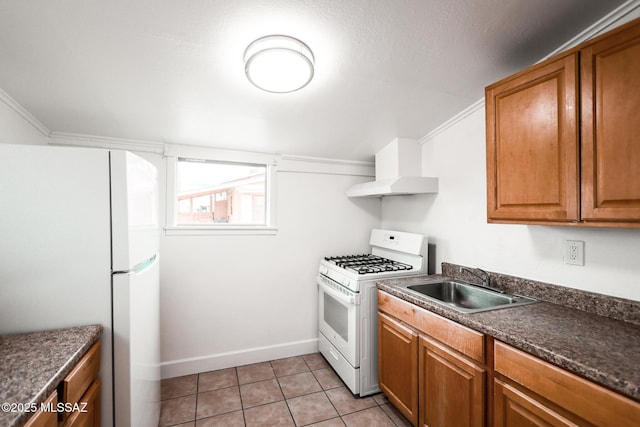 kitchen with dark countertops, exhaust hood, light tile patterned flooring, white appliances, and a sink