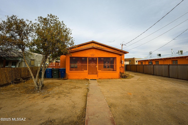view of front facade with fence private yard