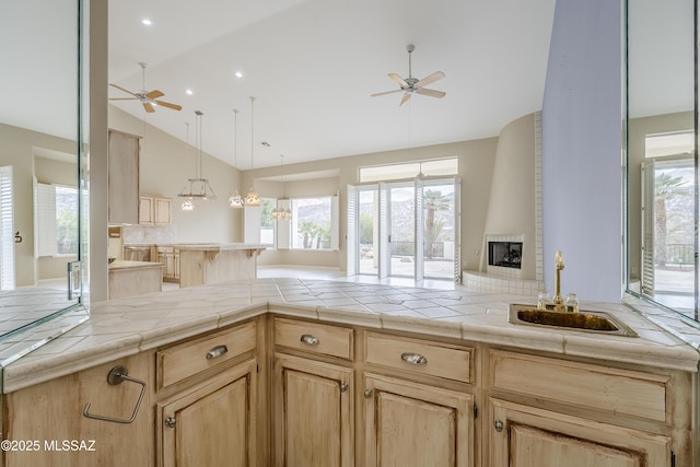 kitchen with light brown cabinets and ceiling fan