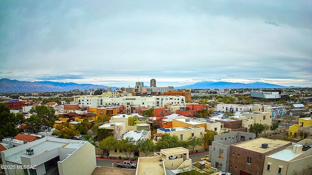 property's view of city featuring a mountain view