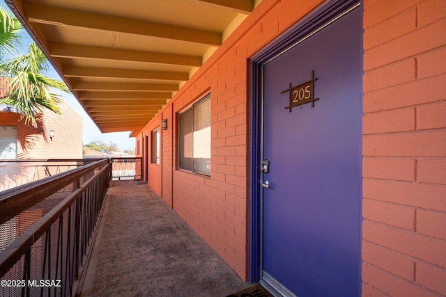 entrance to property with a balcony
