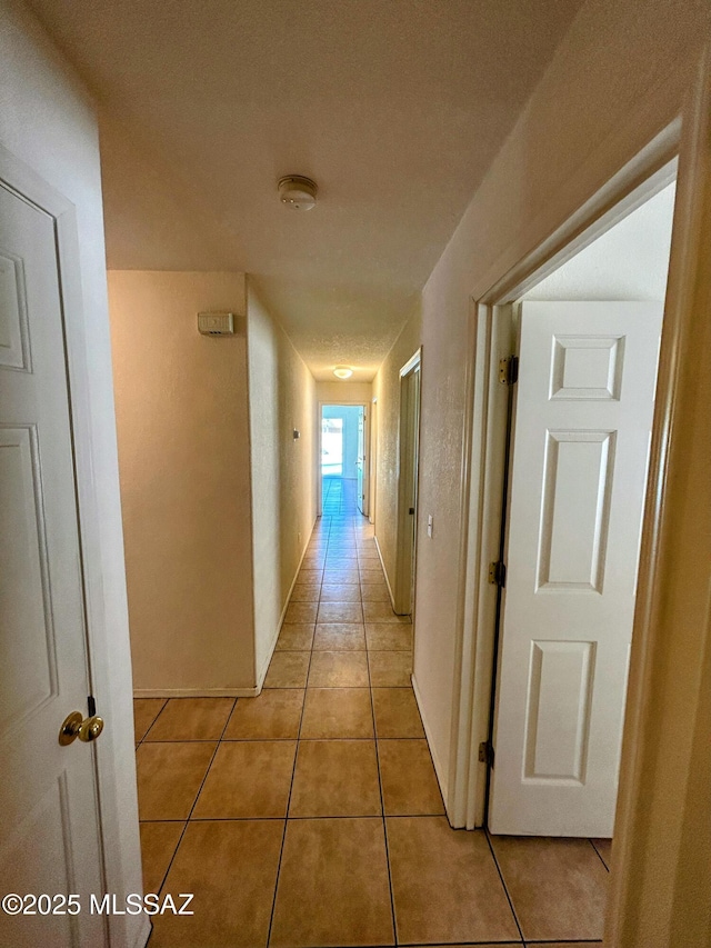 hallway with light tile patterned flooring