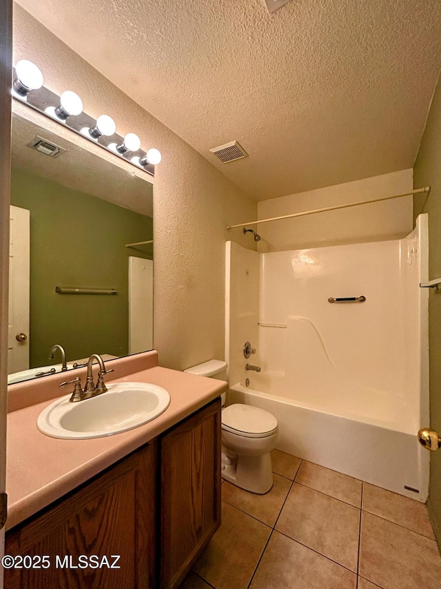 bathroom featuring toilet, tile patterned floors, vanity, and visible vents