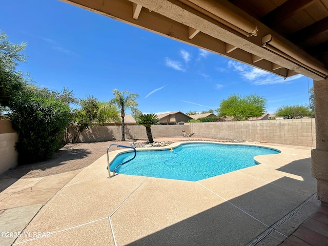 view of swimming pool featuring a patio, a fenced backyard, and a fenced in pool