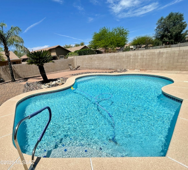 view of swimming pool with a fenced backyard and a fenced in pool