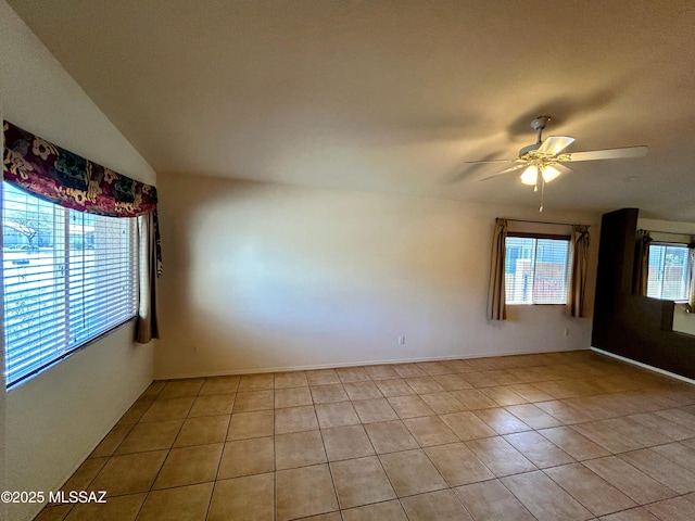 unfurnished room featuring light tile patterned floors and a ceiling fan