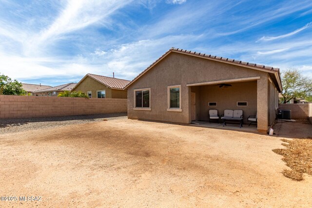 7483 S Salt Water Dr, Tucson, AZ 85757 - rear view of property with a ceiling fan, a fenced backyard, stucco siding, central air condition unit, and a patio area