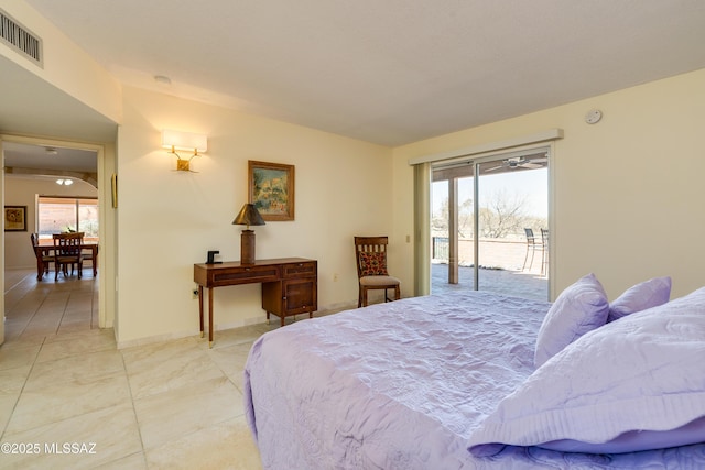 bedroom with visible vents, baseboards, and access to exterior