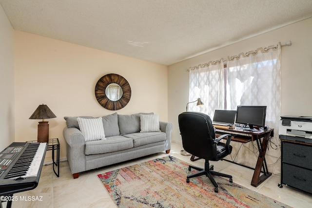 home office featuring light tile patterned flooring and a textured ceiling