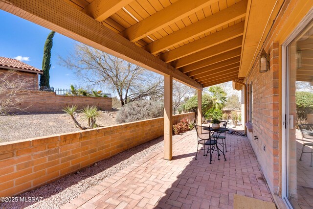 view of patio / terrace featuring outdoor dining space and fence