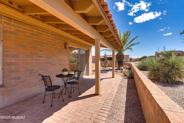 view of patio / terrace featuring fence