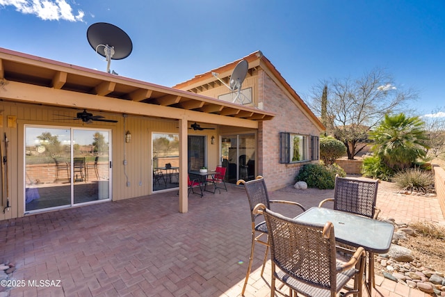 view of patio / terrace with outdoor dining area and ceiling fan